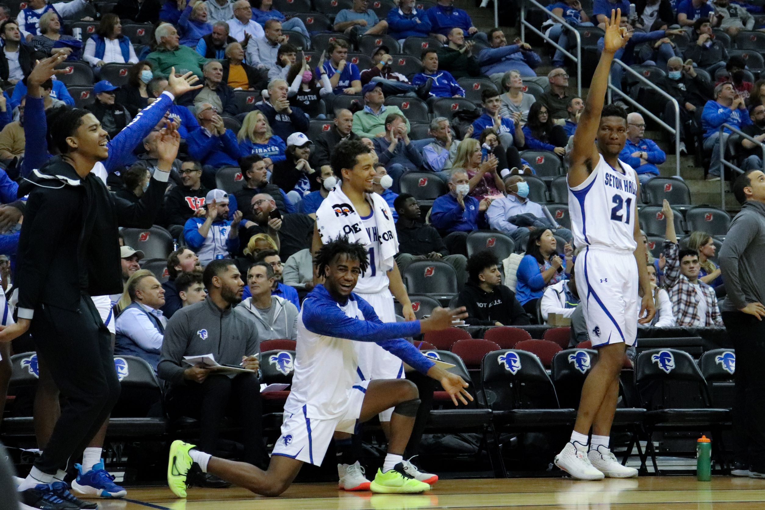 Seton Hall Pirates celebrate on the sidelines during a game.