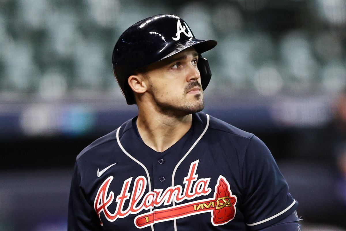 Adam Duvall walks past the plate during a MLB game with the Braves.