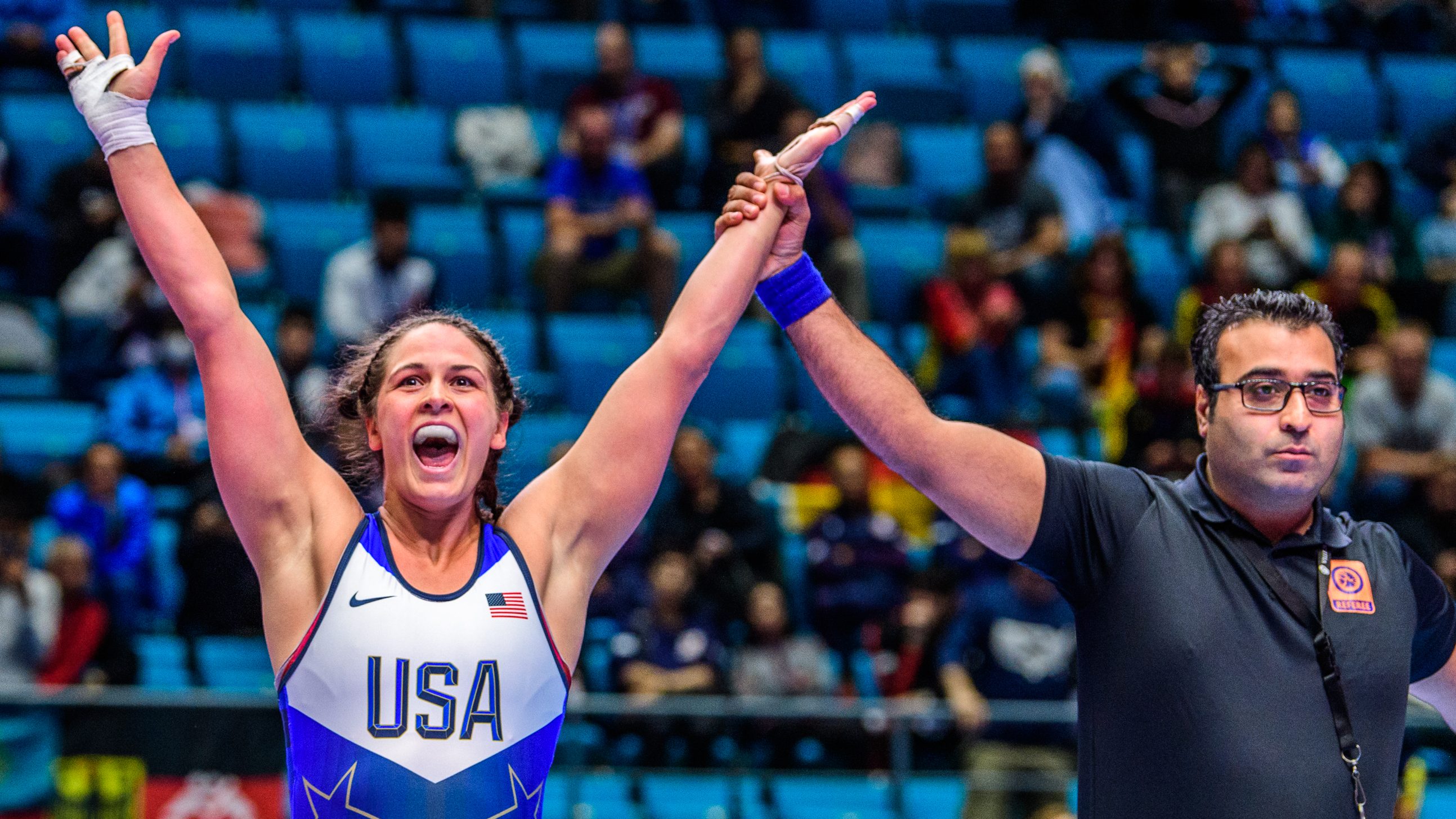 Adeline Gray is announced the winner after a wrestling match.