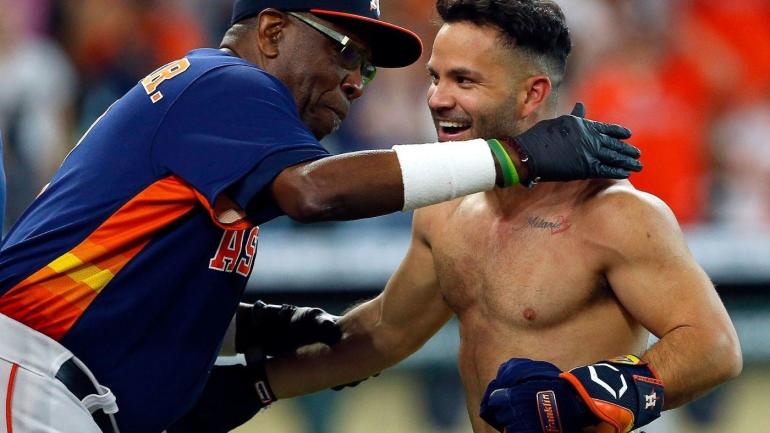 Jose Altuve celebrates with his manager after hitting a home run.