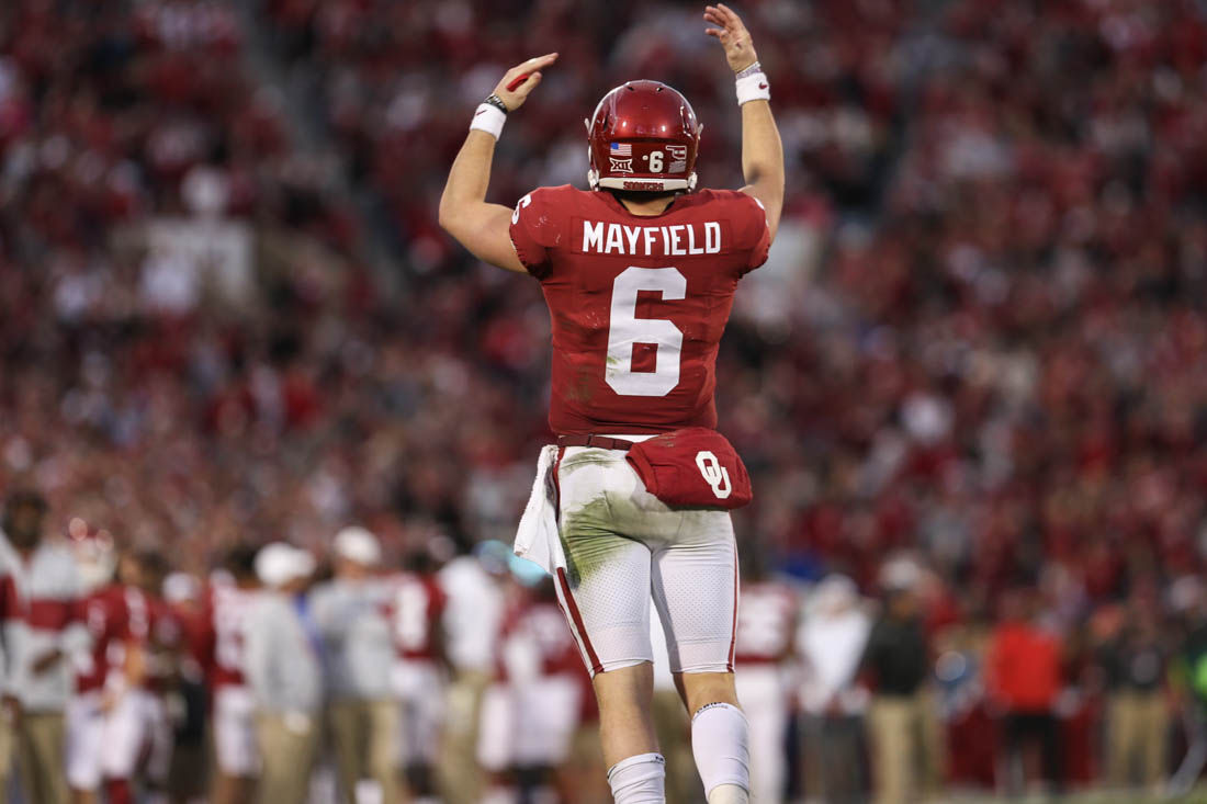 Baker Mayfield celebrates during an Oklahoma Sooners football game.