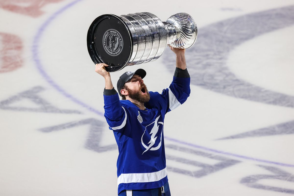 Barclay Goodrow raises the Stanley Cup after winning with the Lightning.