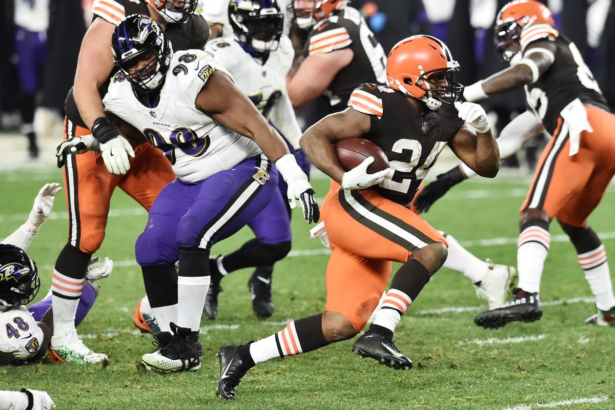 Cleveland's Nick Chubb runs against the Baltimore Ravens defense during a NFL game.