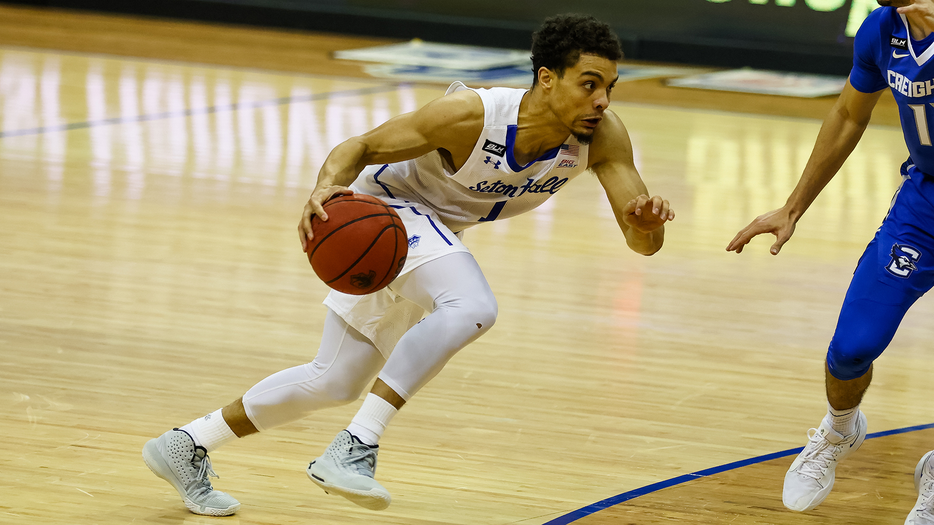Seton Hall's Bryce Aiken drives to the basket during a Pirates basketball game.