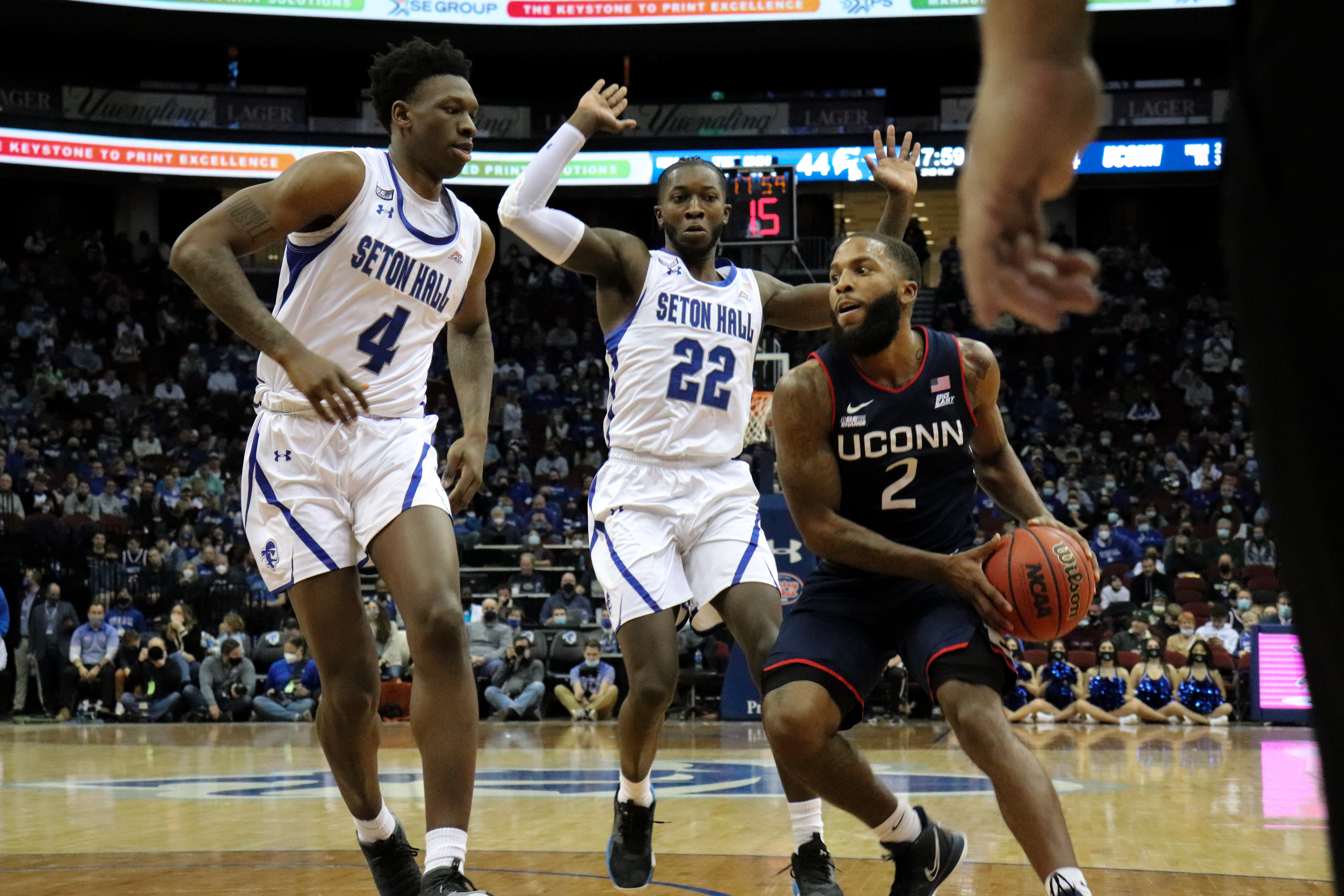 Seton Hall's Tyrese Samuel and Myles Cale play defense against UConn's R.J. Cole during a home game.