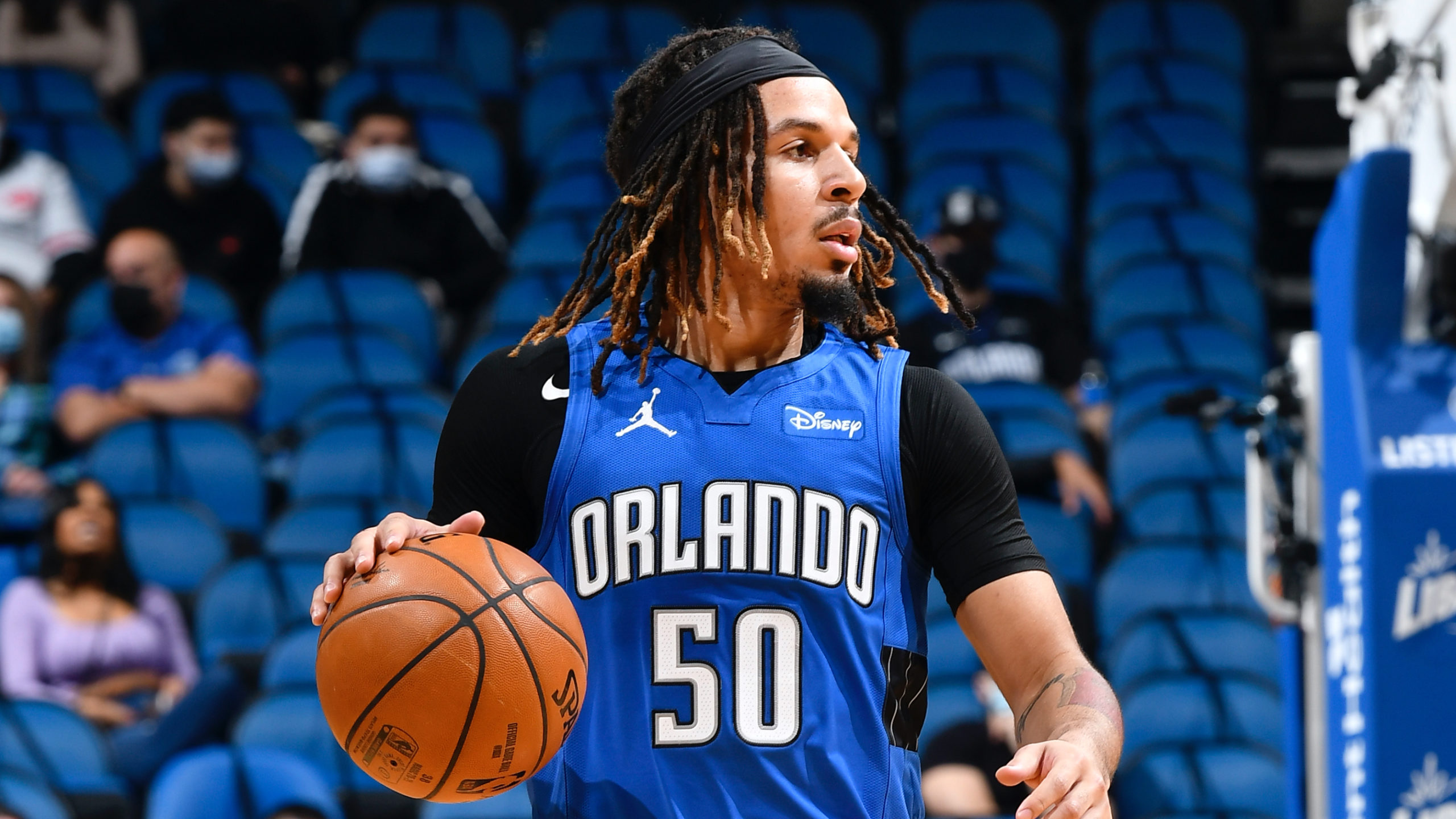 Orlando's Cole Anthony looks to dribble the ball during a Magic game.