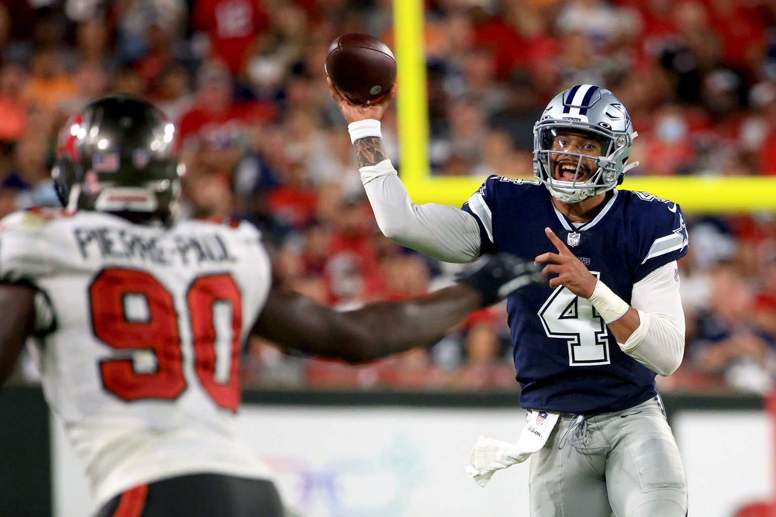 Dallas' Dak Prescott throws a pass during the NFL season opener against Tampa Bay.