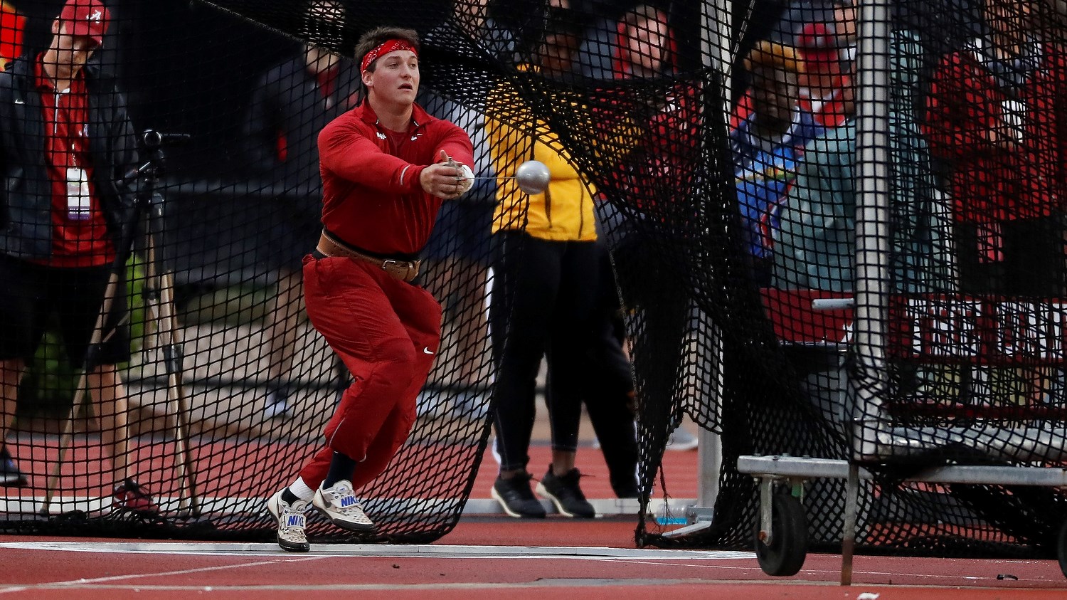 Daniel Haugh throws a hammer during the hammer throw in a field event for his college.