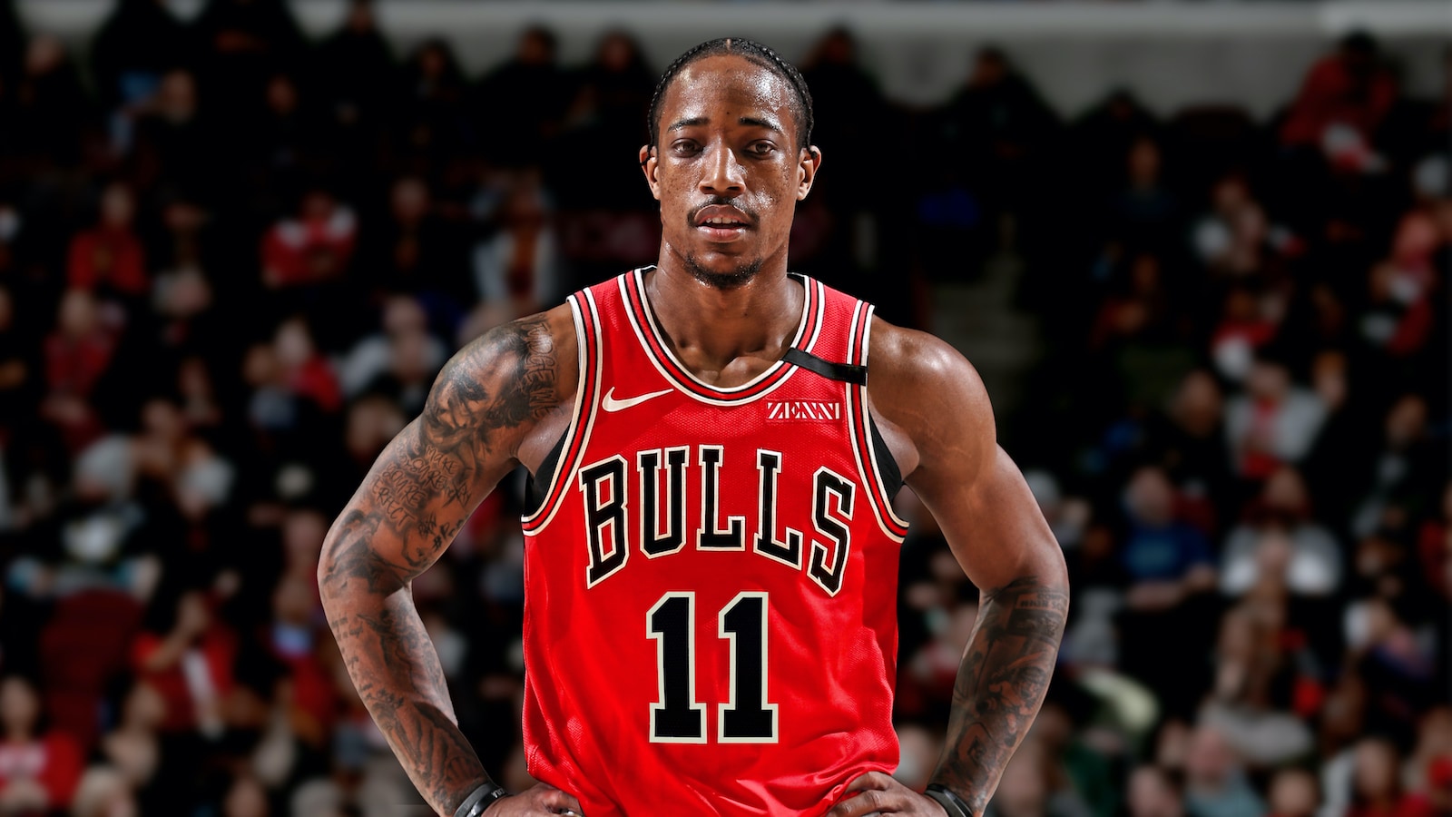 DeMar DeRozan is shown with a Chicago Bulls jersey while standing on an NBA court.