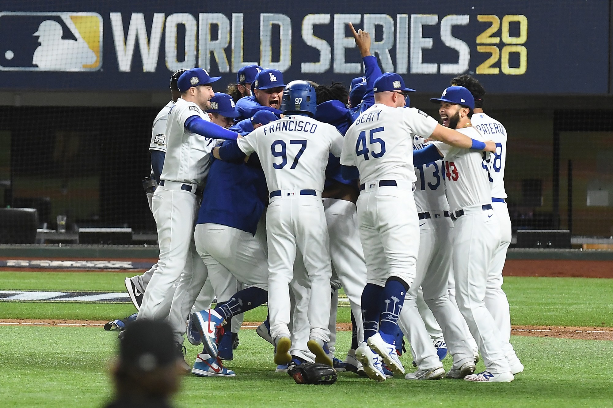 A group of Dodgers' players celebrate after winning a World Series title.