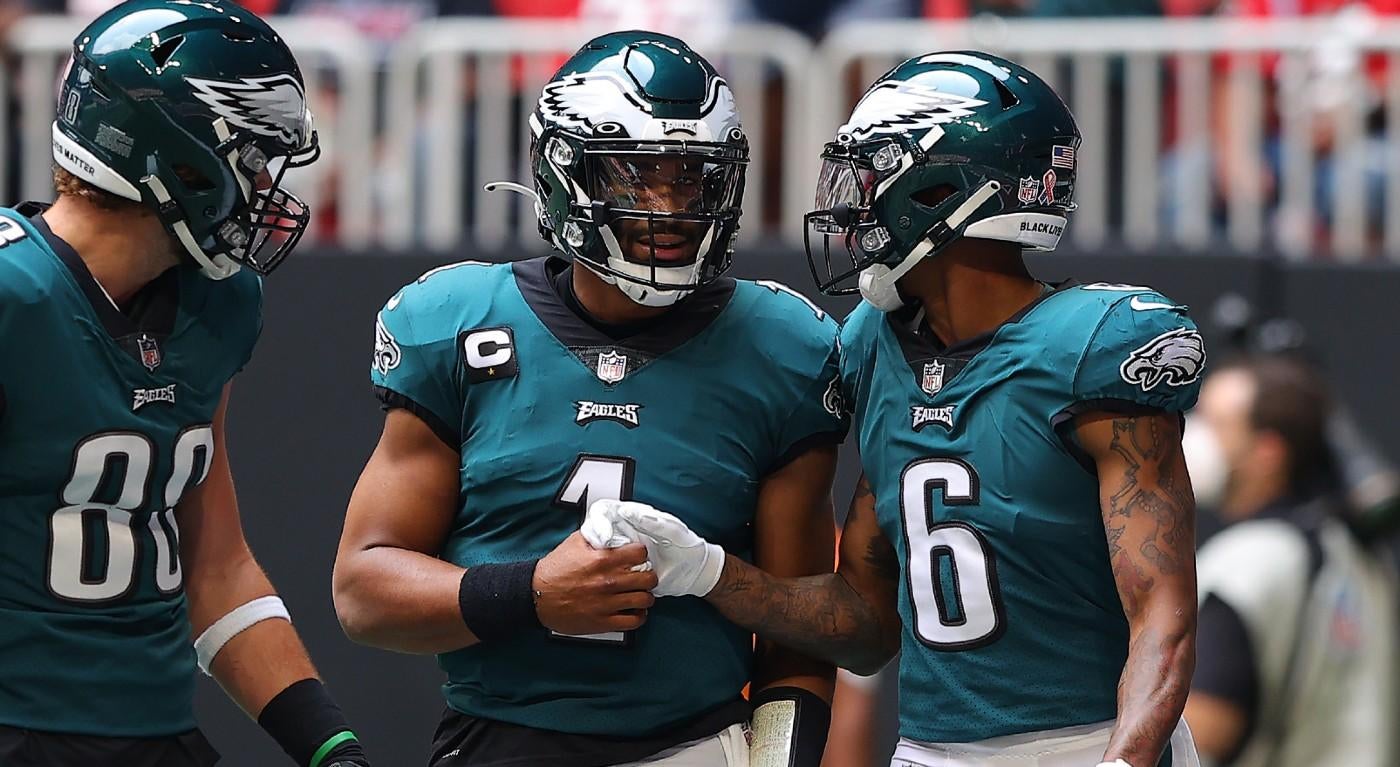 Three Philadelphia Eagles celebrate during a NFL game.