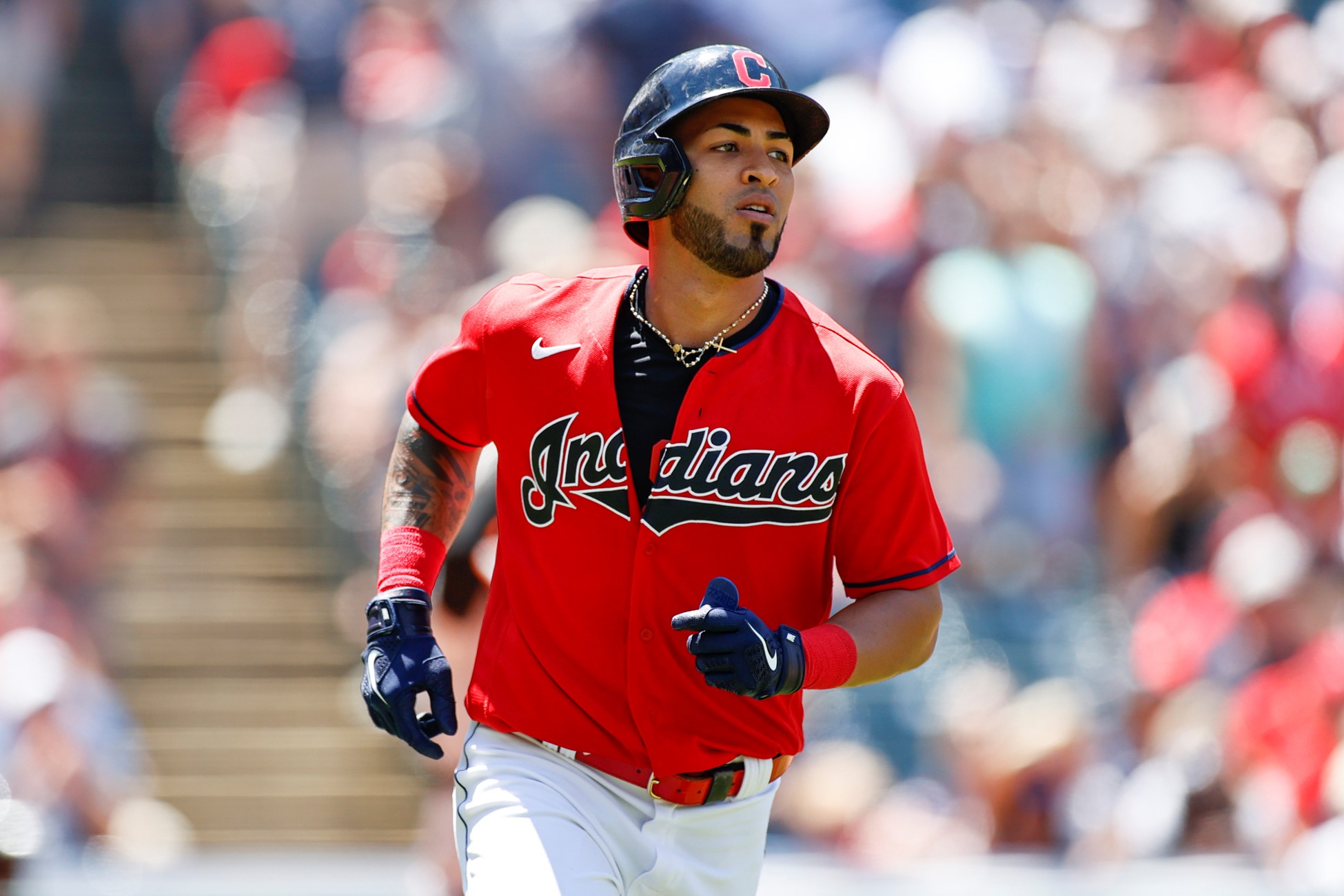 Eddie Rosario jogs to first base during a MLB game with Cleveland..