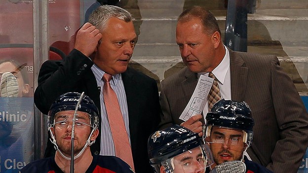 Gerard Gallant and assistant coaches gameplan during an NHL game.