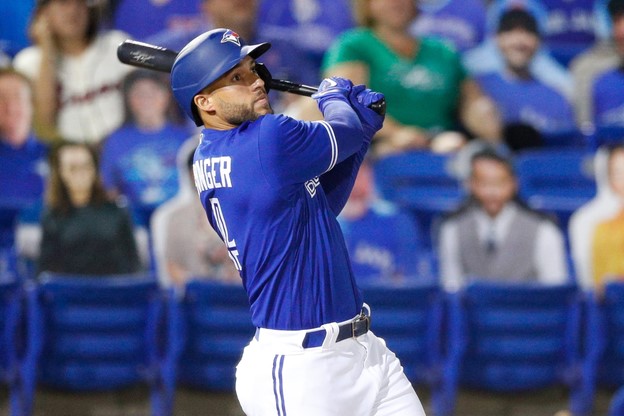 Toronto Blue Jays' George Springer swings the bat during a MLB game.