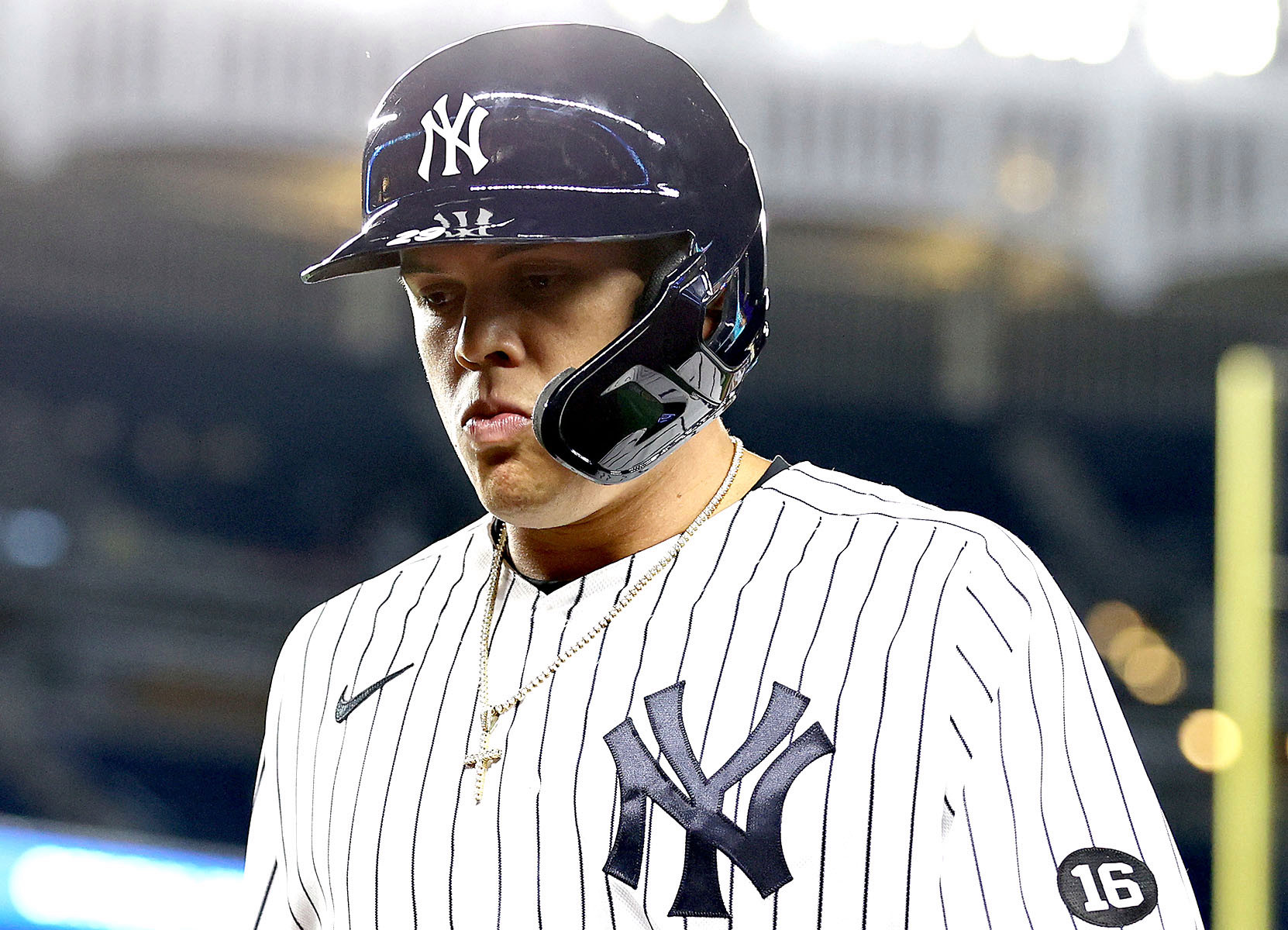 Gio Urshela stands on the field at Yankee Stadium during a game.