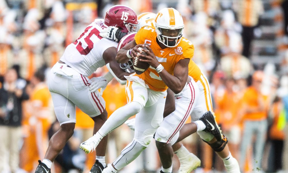Hendon Hooker scrambling through the Alabama D.