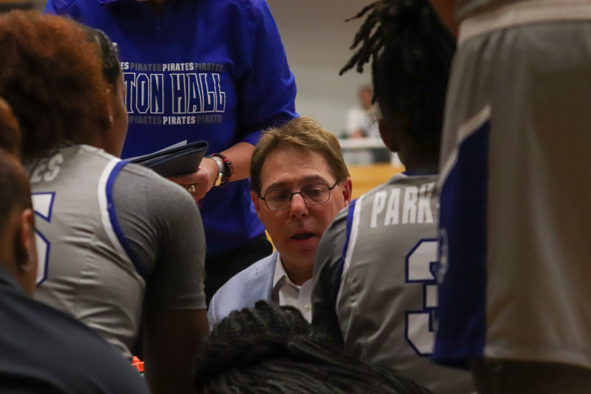 Coach Bozzella in the huddle with the Pirates.