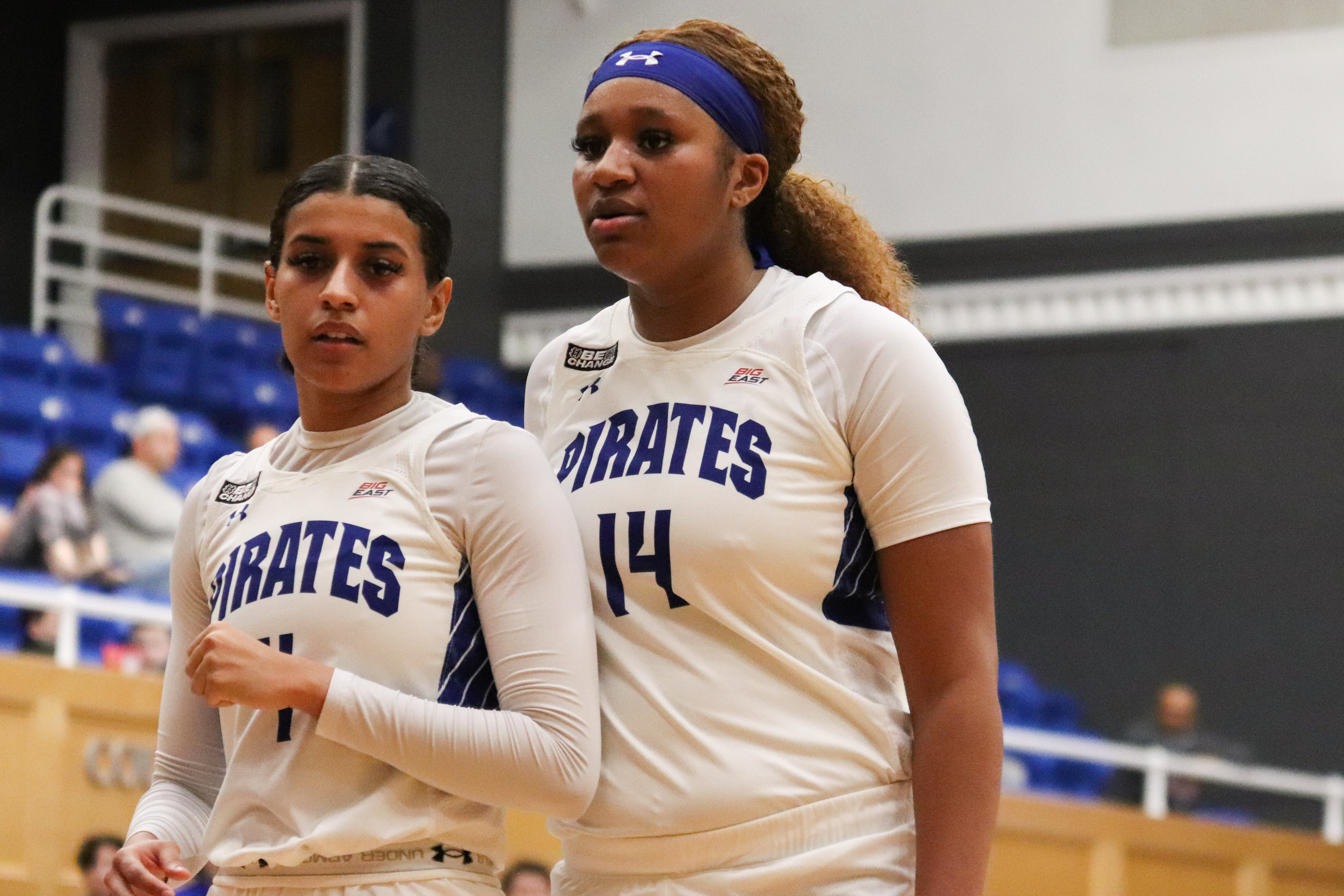 Seton Hall's Sidney Cooks and Andra Espinoza-Hunter stand on the court during a home game.