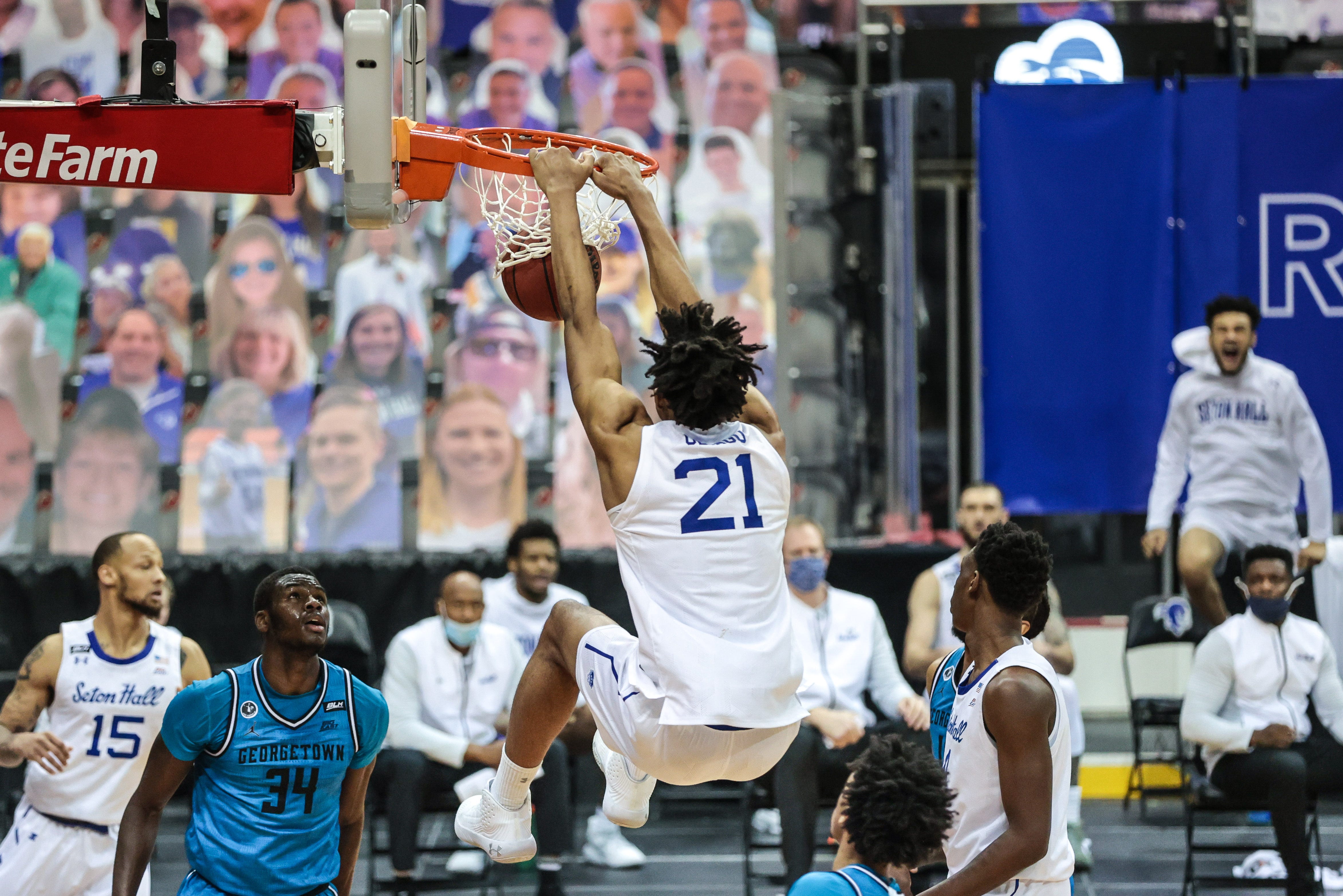 Ike Obiagu dunks the basketball with two hands during a Seton Hall men's basketball game.