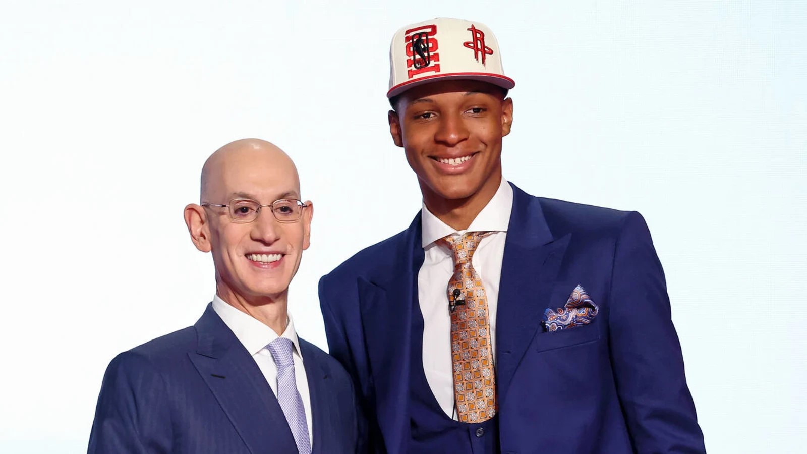 Jabari Smith Jr. stands with NBA Commissioner Adam Silver. 