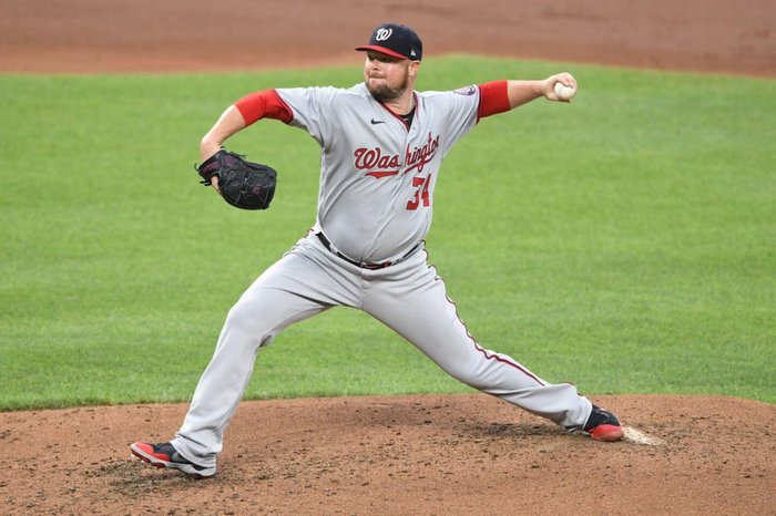 Jon Lester throws a pitch during a MLB game.