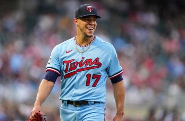 Former Minnesota Twins' Jose Berrios smiles while walking off the mound during a MLB game.