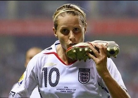 Kelly Smith kisses her shoe after a professional soccer game.