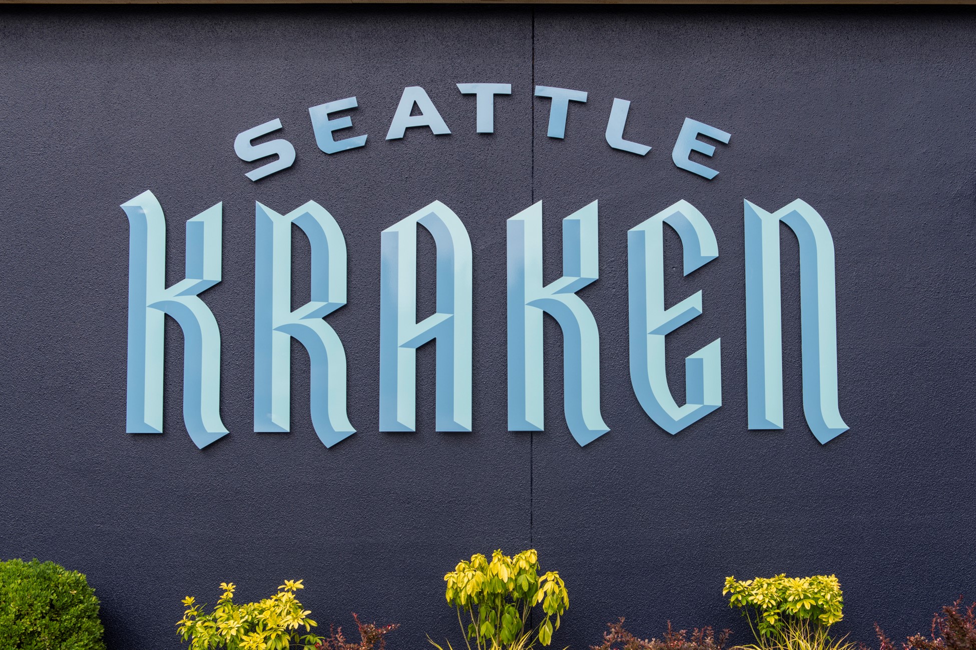 The Seattle Kraken team letters is shown on a wall during NHL free agency.