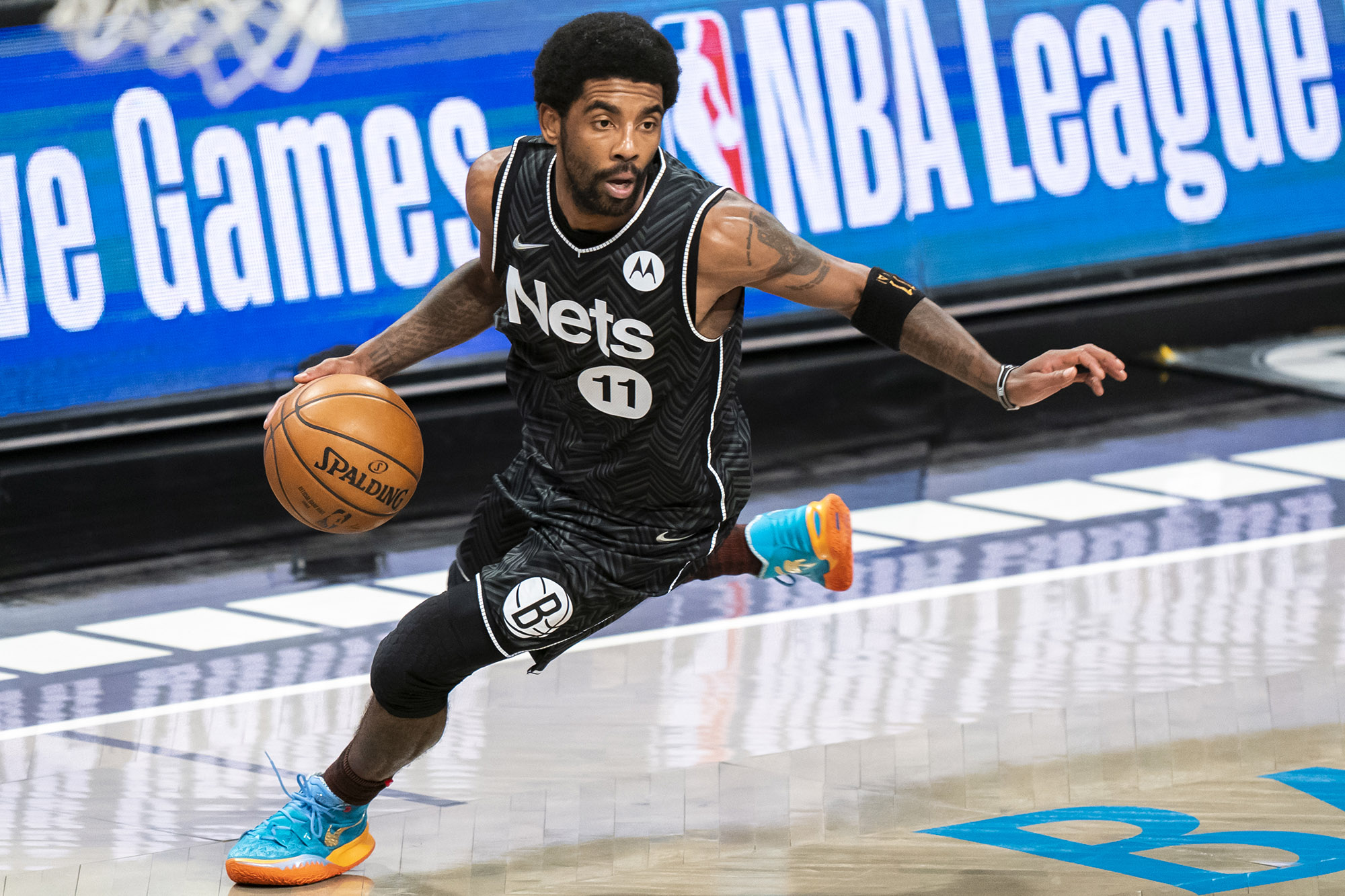 Brooklyn's Kyrie Irving dribbles the basketball during a Nets game.