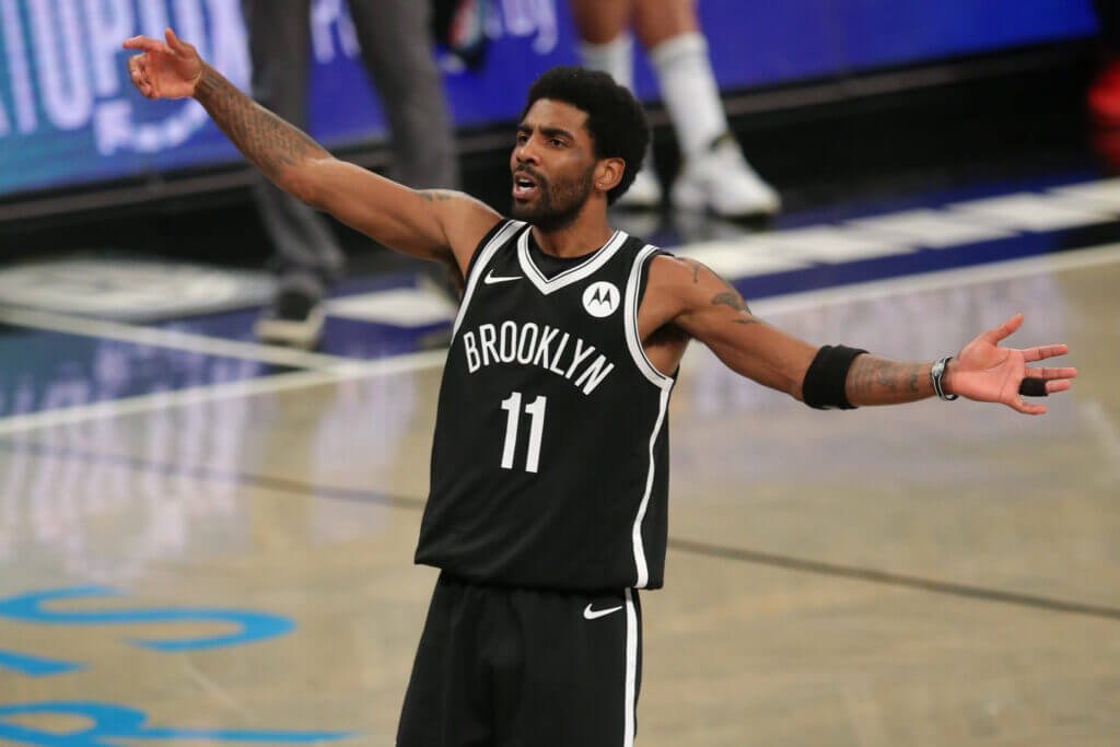 Brooklyn's Kyrie Irving plays defense during a Nets game.