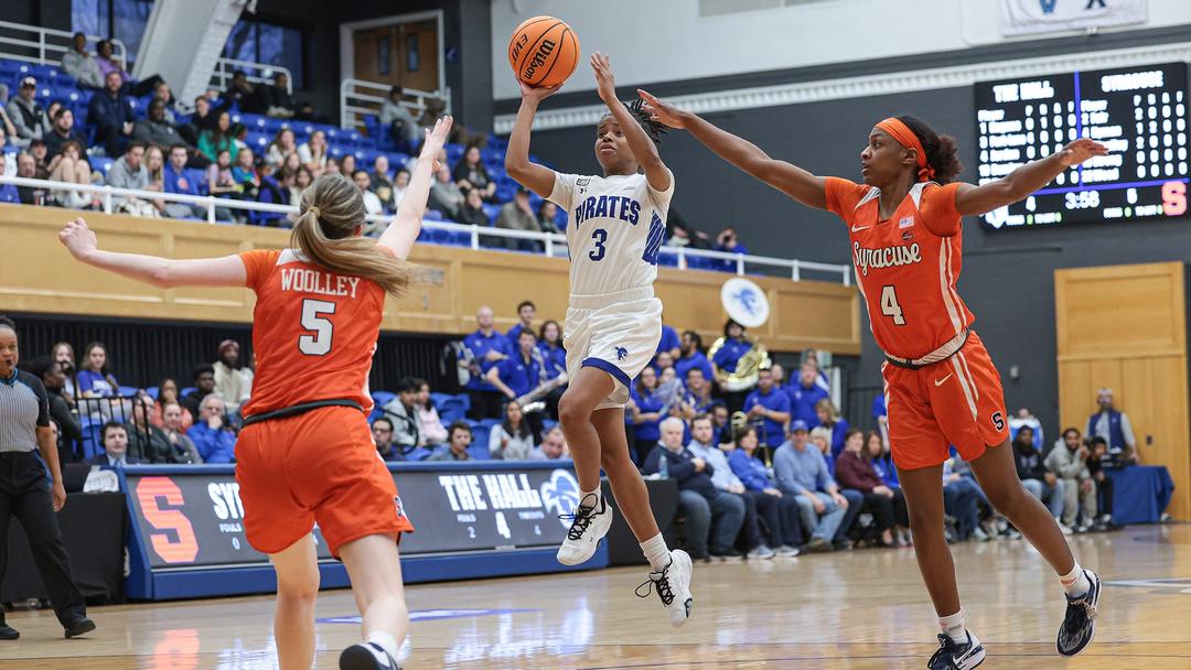 Lauren Park-Lane with the floater over two Orange defenders.