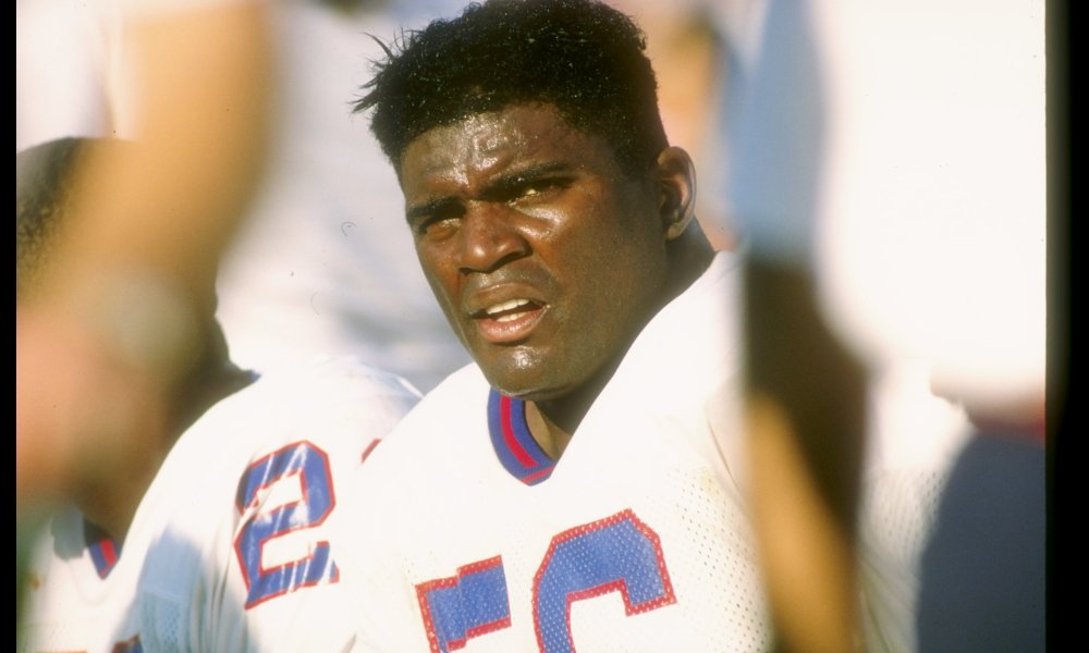 New York Giants defender Lawrence Taylor sits on the bench during a NFL game.