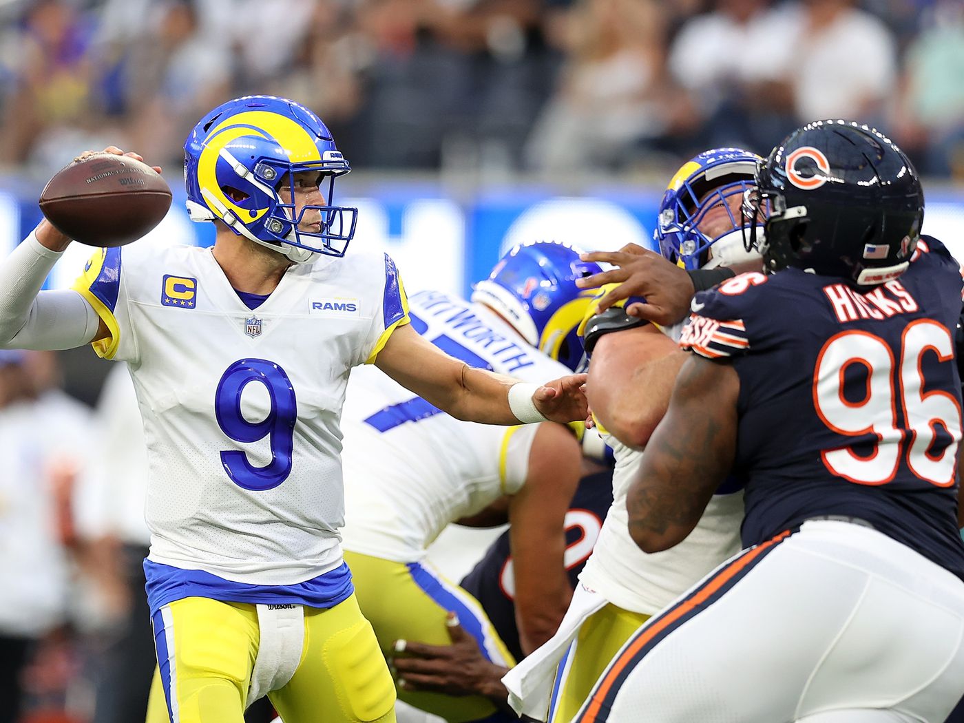 Matthew Stafford throws a pass for the Los Angeles Rams in a game against the Chicago Bears.
