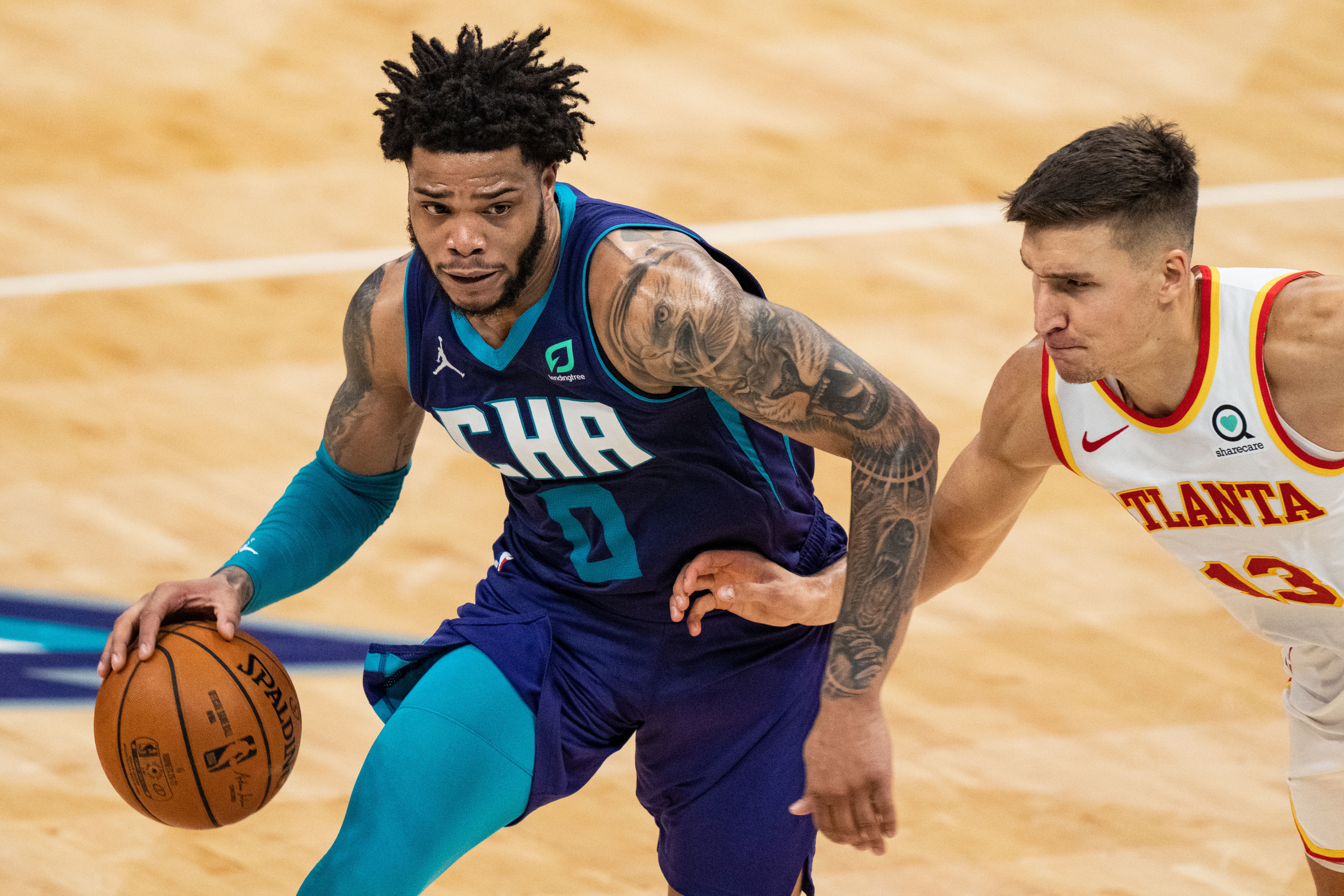 Charlotte's Miles Bridges dribbles the basketball during a Hornets game.