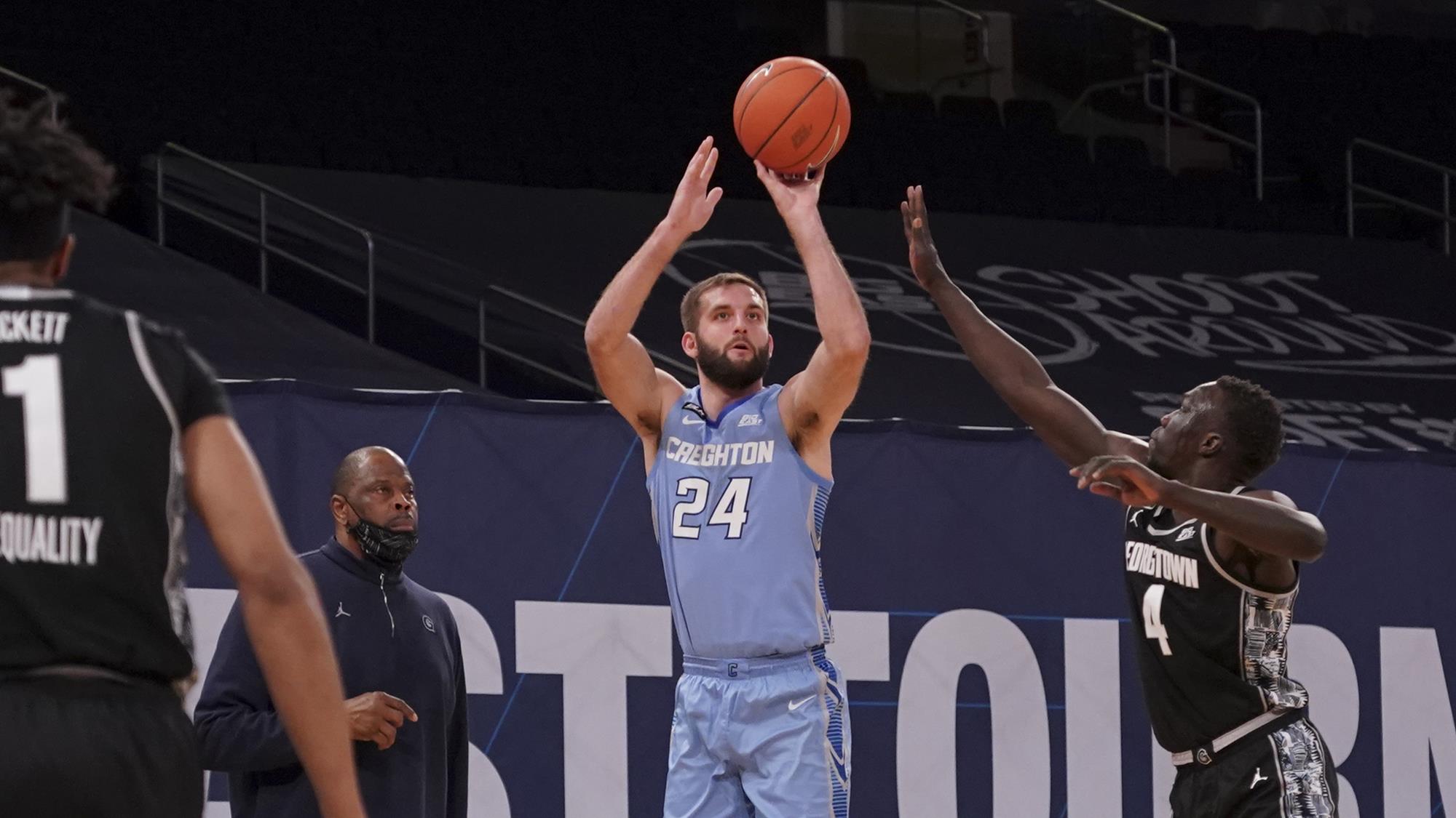 Mitch Ballock shoots a three-pointer from the corner during a Creighton men's basketball game.