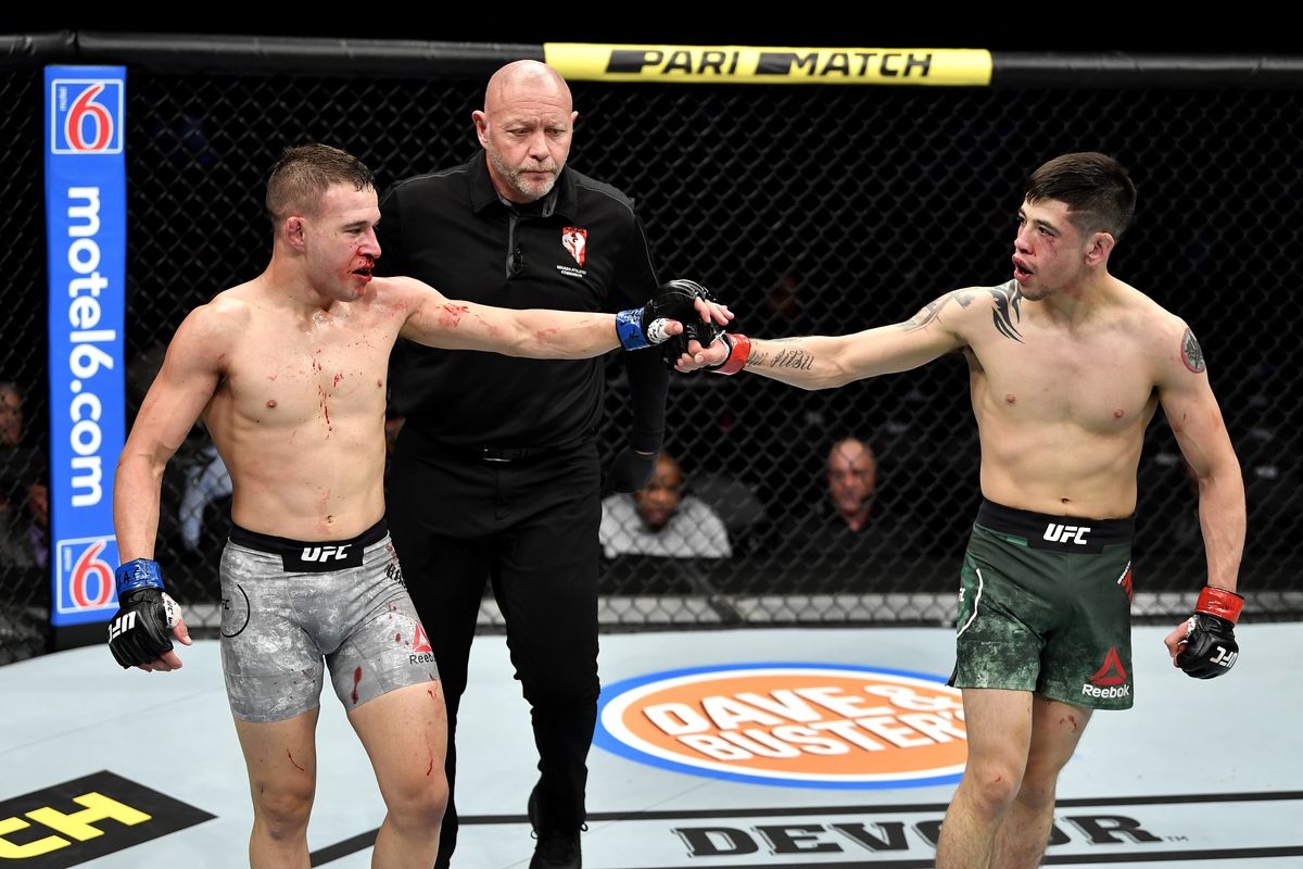 Moreno and Kara-France fist bump in the octagon.