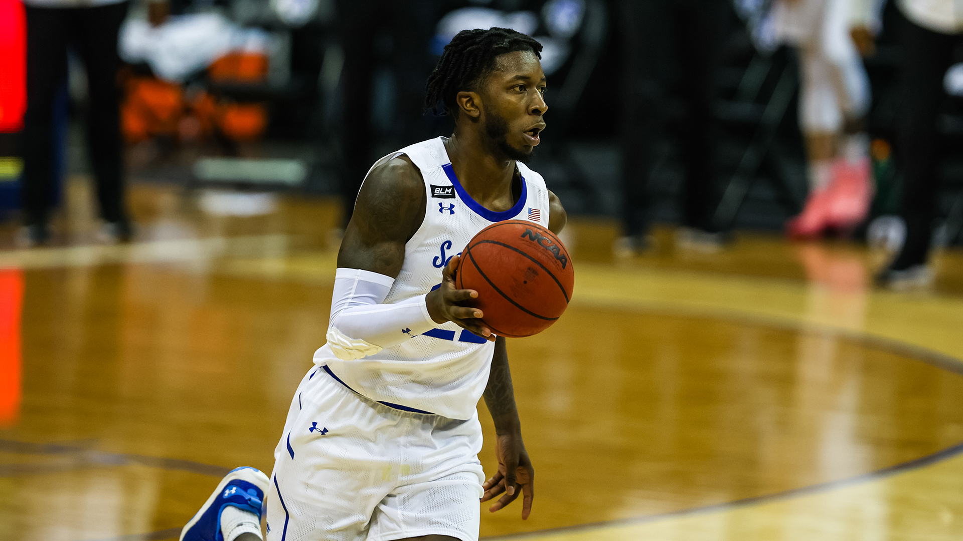 Myles Cale dribbles the ball in the open floor during a Seton Hall basketball game.