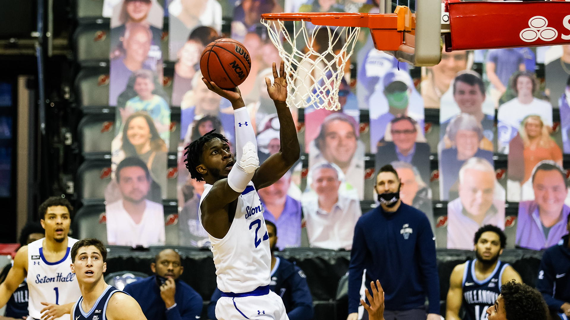 Myles Cale grabs a rebound and attempts to score a layup during a Seton Hall basketball game.