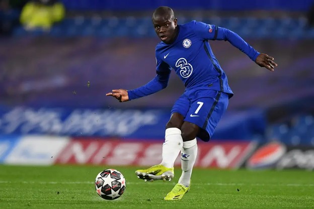 N'Golo Kante passes the ball with the side of his foot during a game.