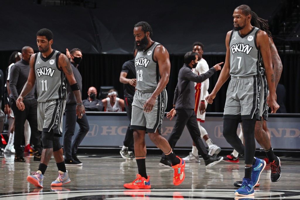 Kyrie Irving, James Harden and Kevin Durant walk off the court during a Brooklyn Nets' game.
