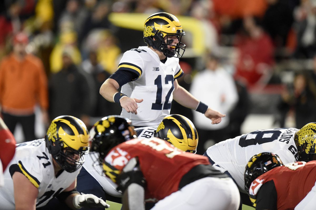 Michigan football plays against another team during a college football game.