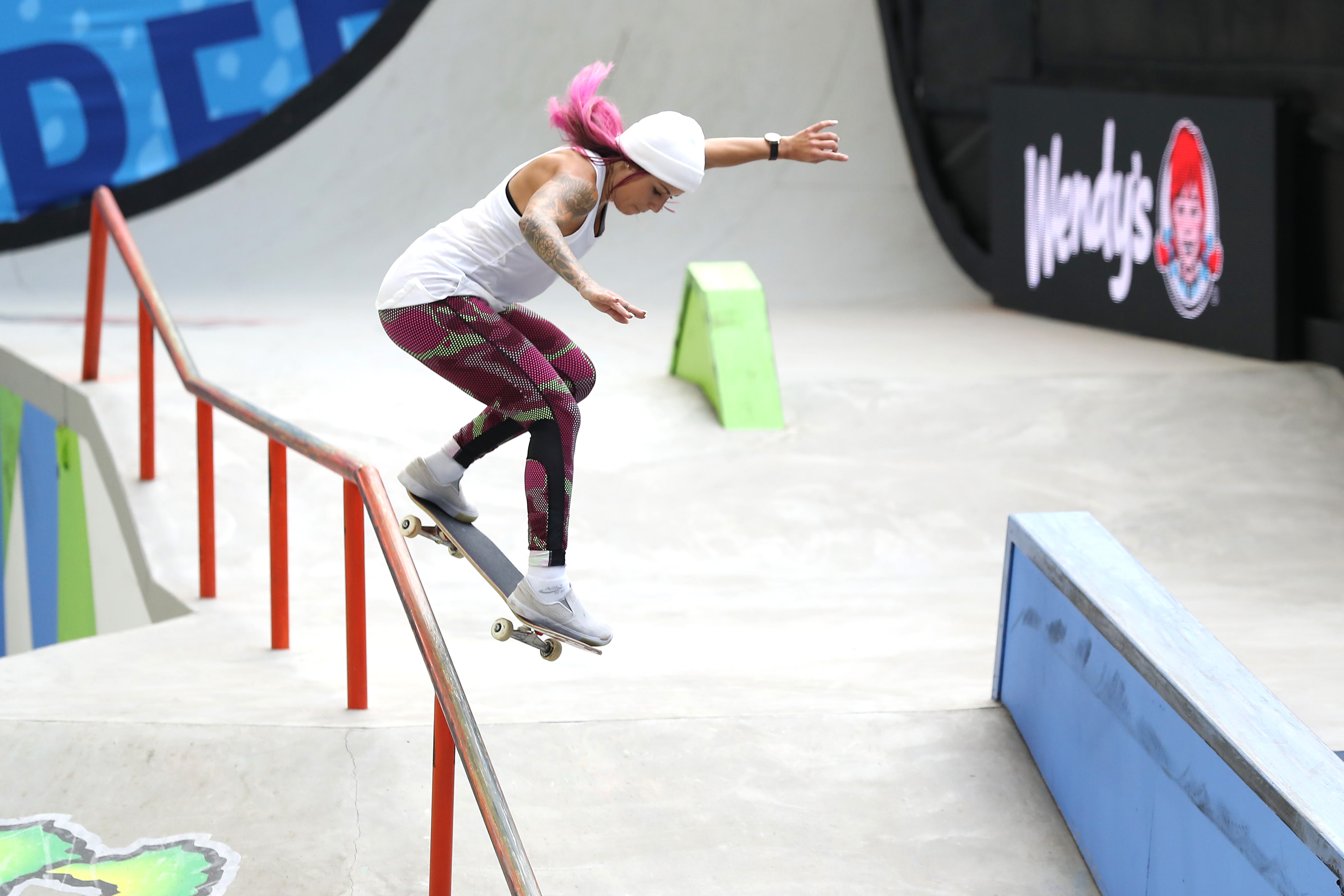 A skateboarder skates on a course during a competition.