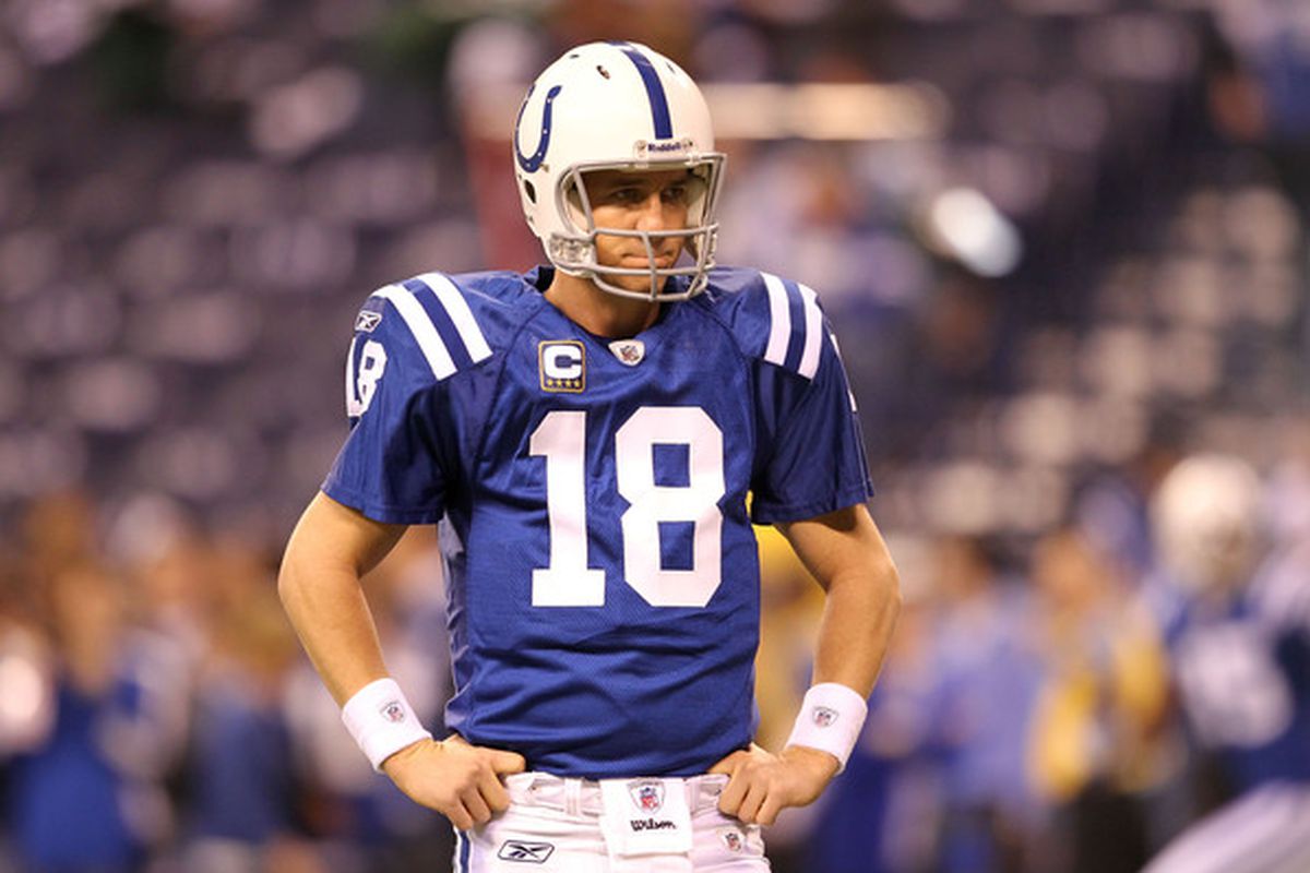 Indianapolis Colts quarterback Peyton Manning stands on the field during a NFL game.