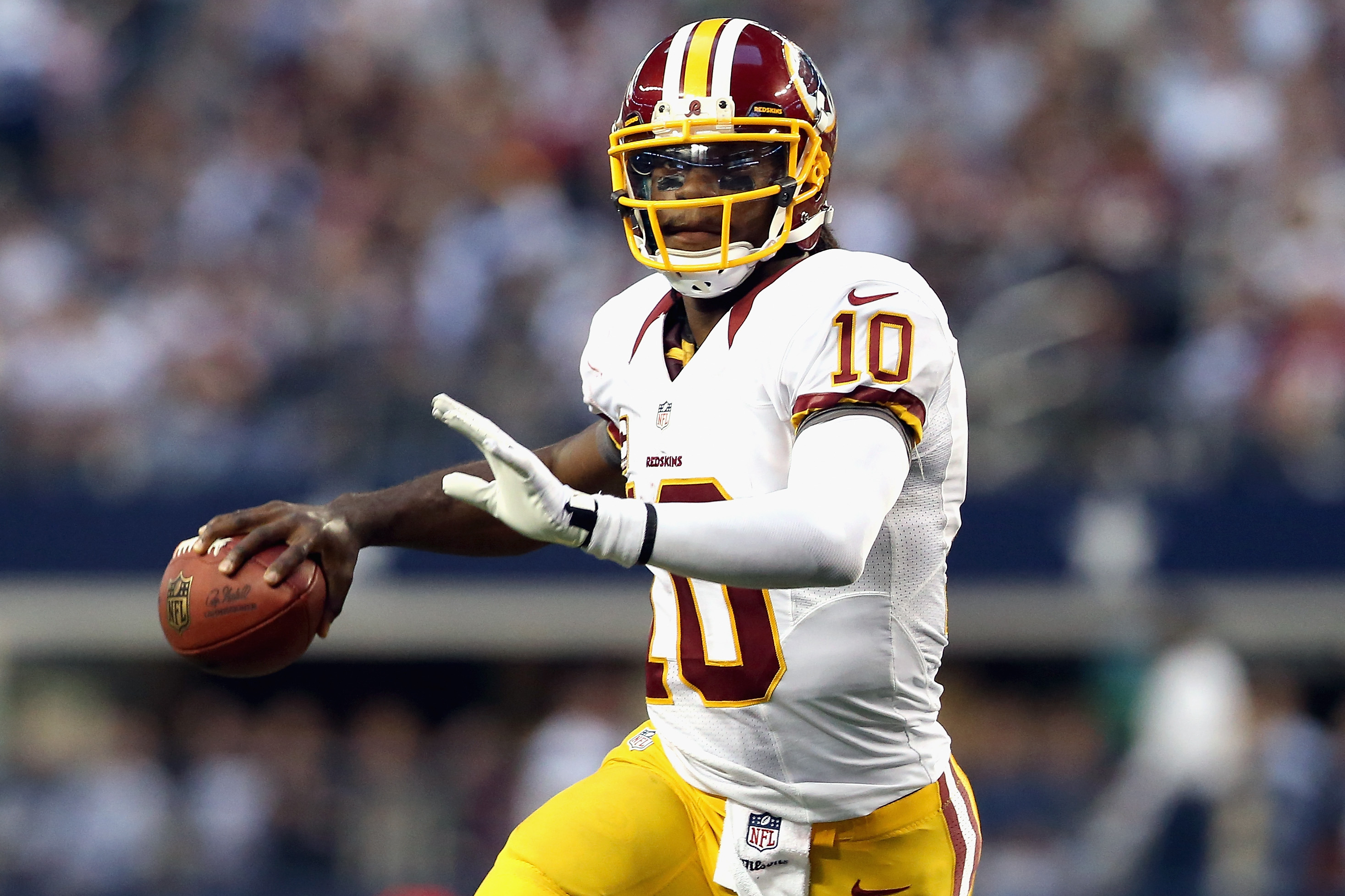 Washington's Robert Griffin III attempts a pass during a NFL Thanksgiving game against the Dallas Cowboys.
