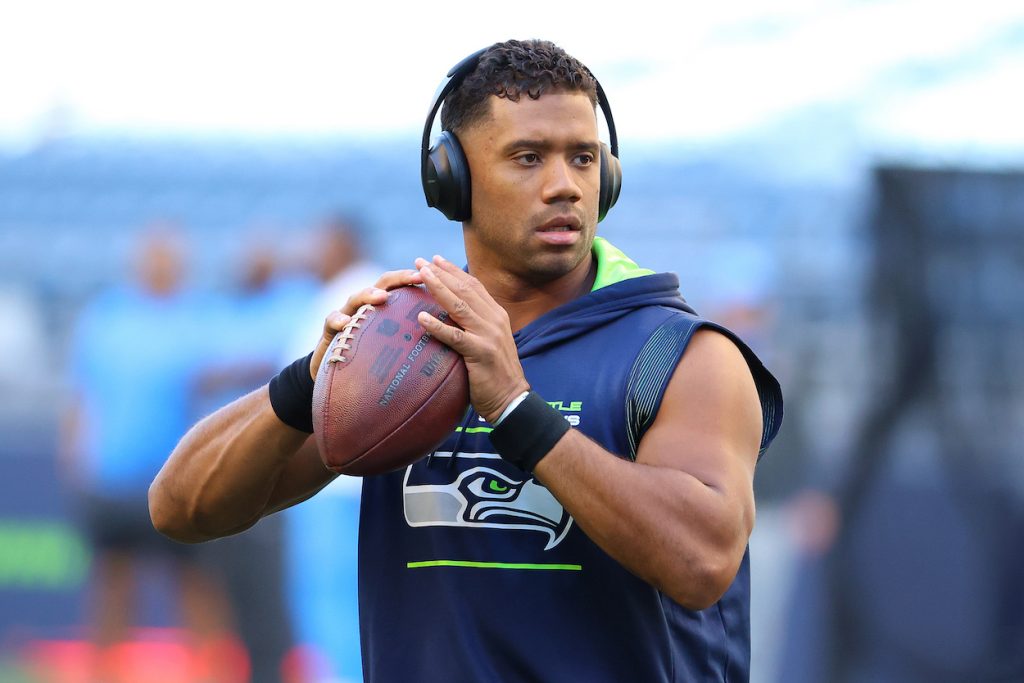 Russell Wilson warms up with a football before a Seattle Seahawks game.