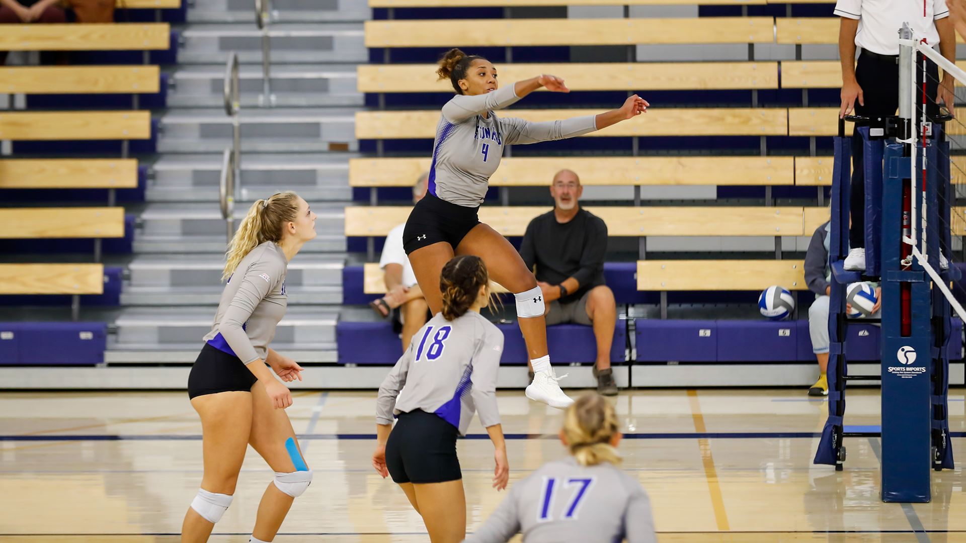A Seton Hall women's volleyball player attempts a spike during a road match at the Fairfield Invitational Tournament.
