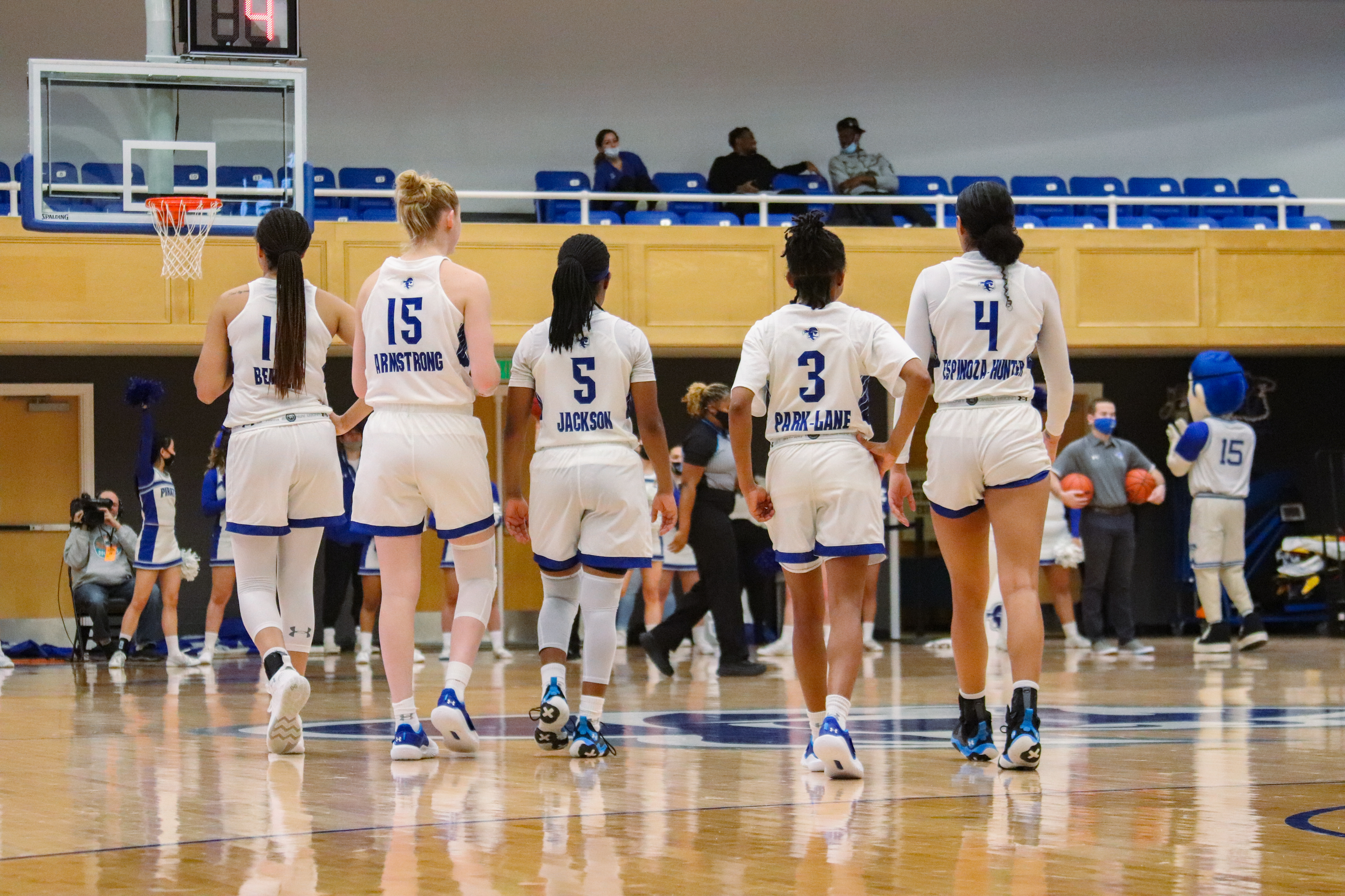 The Seton Hall women's basketball team's starting five stand on the Walsh Gym floor.