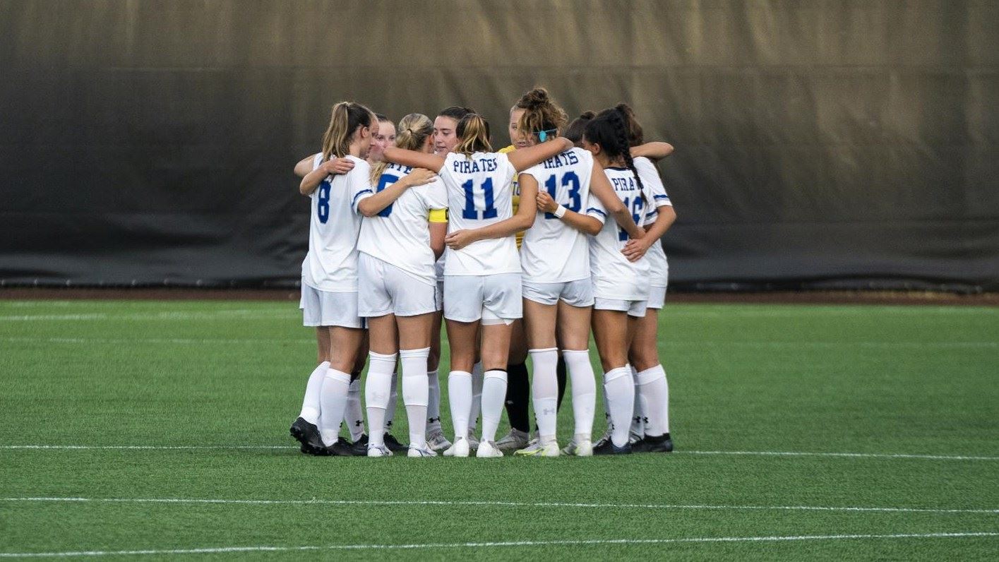 The Seton Hall women's soccer team huddle before a game.