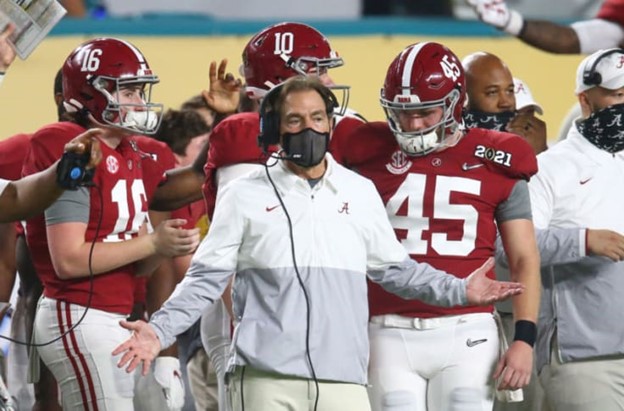 Nick Saban stands on the sidelines during an Alabama football game.