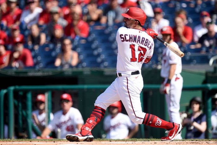 Former Washington Nationals' Kyle Schwarber takes a swing during a MLB game.